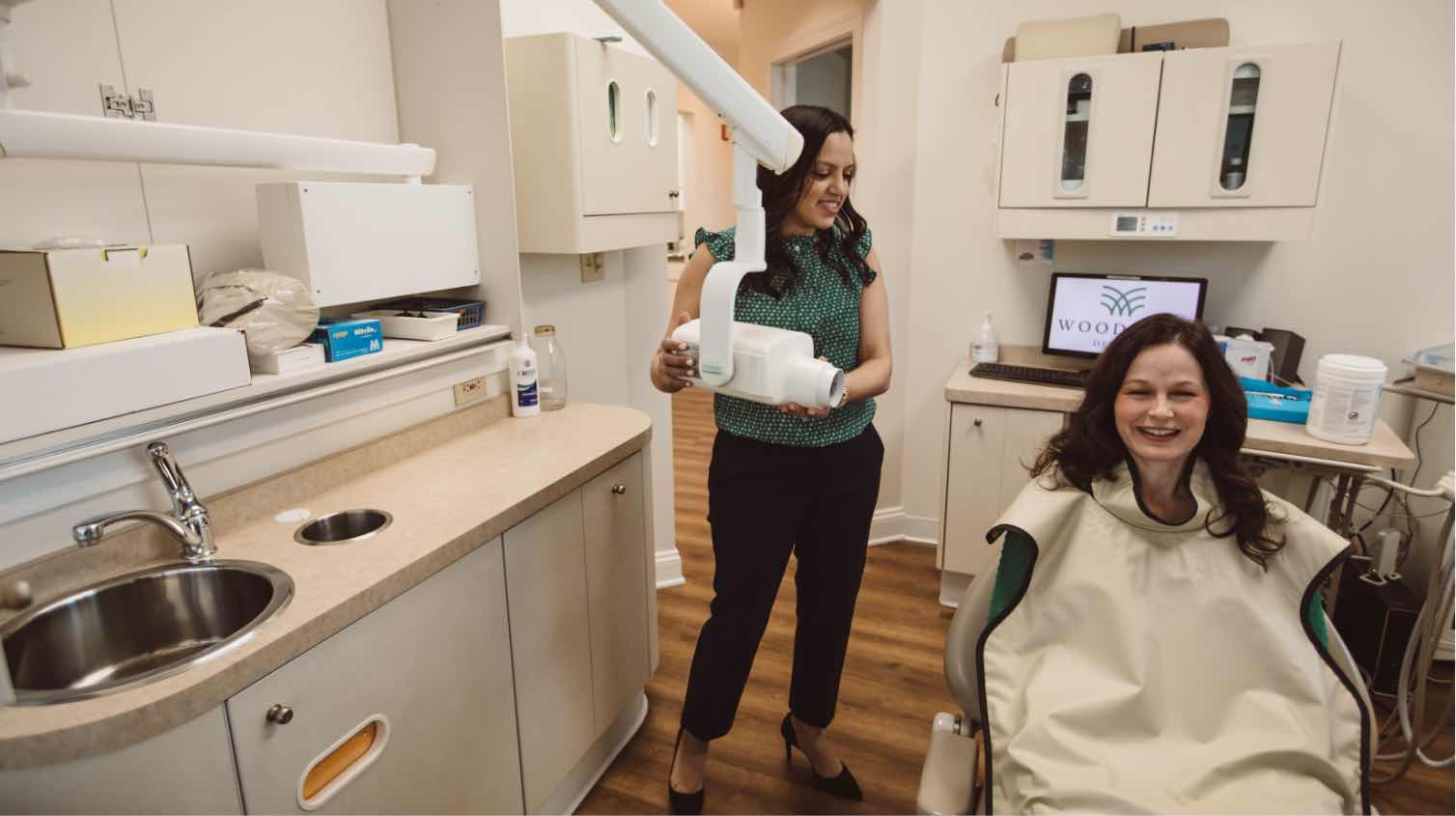 Photo of Dr. Shah preparing to take a scan of a patient